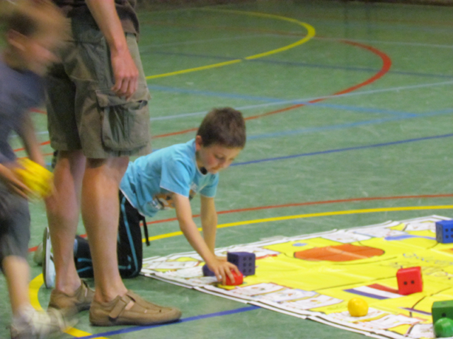 Students playing Basketball Skillastics on gym floor