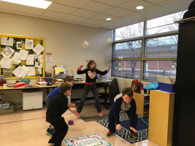 Students in multi-purpose room playing Skillastics during After School Program