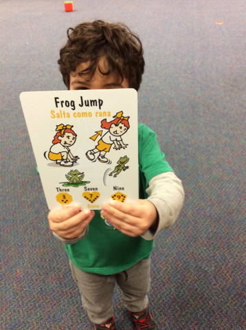 Early childhood student displaying Frog Jump physical activity.