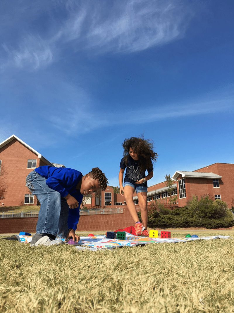 students outdoors exercising and playing Skillastics in After School Program