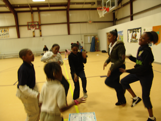 students in gym playing Skillastics during After School program