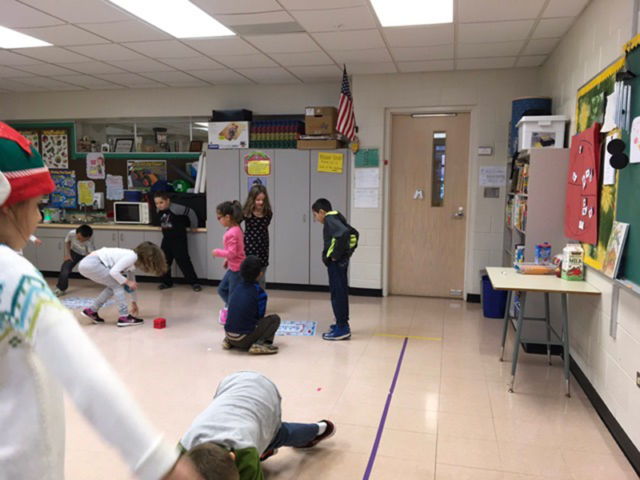 Students in multi-purpose room playing Skillastics during After School Program