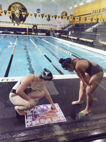 Secondary students in swimsuits by pool playing Fitness Xtreme Skillastics