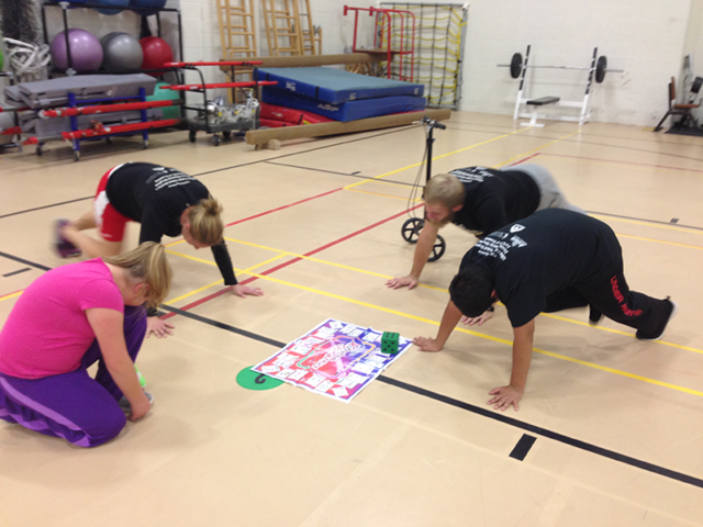 Students being physically active playing Fitness Xtreme Skillastics on gym