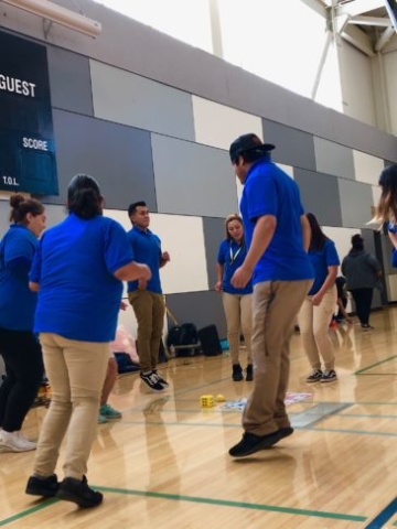 After School instructors participating in a fitness activity during Professional Development Training.