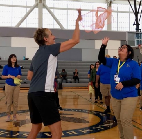 Skillastics CEO, Sandy Slade, demonstrating activity scarf activity during Professional Development Training.