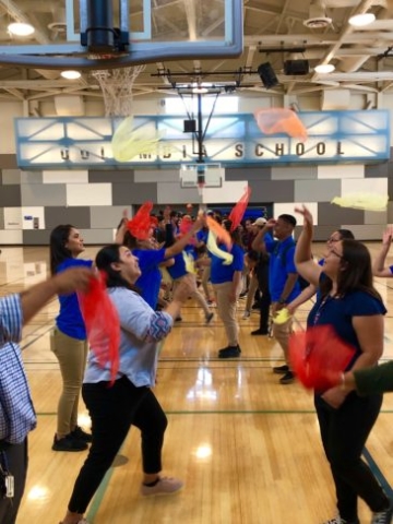 After School instructors practicing tossing activity scarf during Professional Development Training