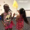 Children tossing the lightweight scarves during an activity session.