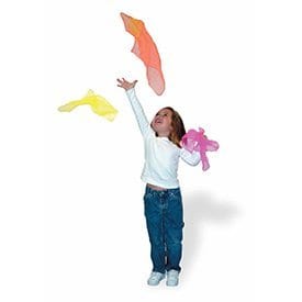 Young girl tossing the lightweight scarves during an activity session.